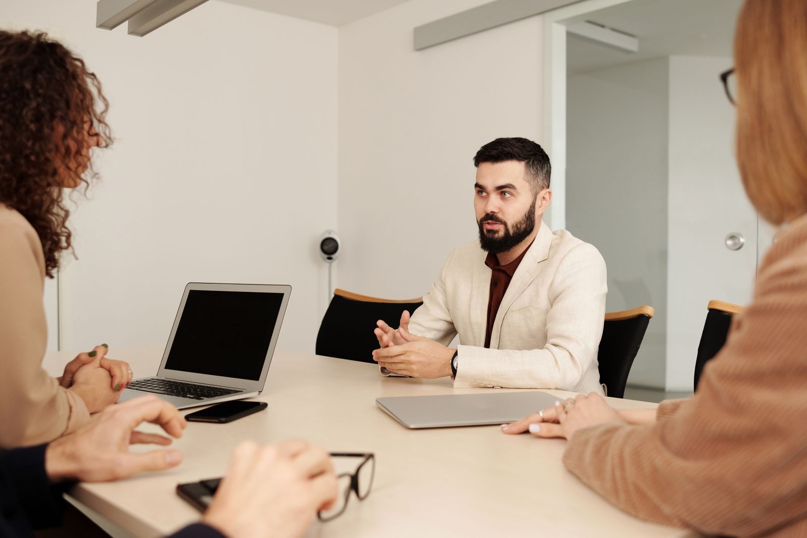 Business professionals engaging in a collaborative meeting in a well-lit office setting
